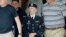 Army Pfc. Bradley Manning, center, is escorted out of a courthouse in Fort Meade, Md., June 17, 2013.