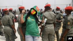 Gendarmerie search Cameroon soccer fans outside the stadium before the African Cup of Nations 2022 quarterfinal match between Gambia and Cameroon at Japoma Stadium, Douala, Cameroon, Jan. 29, 2022.