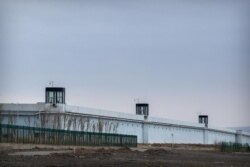 FILE - Guard towers are seen along the perimeter wall of the Urumqi No. 3 Detention Center in Dabancheng in western China's Xinjiang Uyghur Autonomous Region, April 23, 2021.