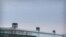FILE - Guard towers are seen along the perimeter wall of the Urumqi No. 3 Detention Center in Dabancheng in western China's Xinjiang Uyghur Autonomous Region, April 23, 2021.