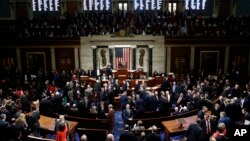 House members vote as House Speaker Nancy Pelosi of Calif., stands on the dais, during a vote on article II of impeachment against President Donald Trump, Wednesday, Dec. 18, 2019, on Capitol Hill in Washington. (AP Photo/Patrick Semansky)