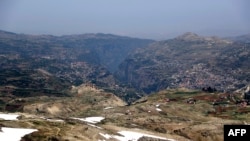 FILE - A representation   taken connected  May 28, 2019, shows the UNESCO World Heritage tract  of the Qadisha valley, surrounded by the towns of Bcharre (R) and Hasroun, successful  the Lebanese mountains northbound  of Beirut.