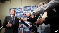 FILE - Democratic presidential candidate former New York City Mayor Michael Bloomberg speaks to reporters after a campaign event, Jan. 27, 2020, in Burlington, Vt. 