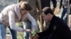 File - Syria's President Bashar al-Assad and his wife Asma, plant trees in city of Draykish, March 8, 2021.
