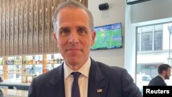 Hunter Biden, son of U.S. President Joe Biden, stands in a food court after the jury finds him guilty on all three counts in his trial on criminal gun charges, in Wilmington