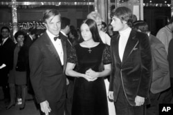 FILE - "Romeo and Juliet" movie director Franco Zeffirelli, left, and actors Olivia Hussey, center, and Leonard Whiting are seen after the premiere of the film in Paris, Sept. 25, 1968.