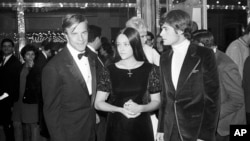 FILE - "Romeo and Juliette" movie director Franco Zeffirelli, left, actors Olivia Hussey, center, and Leonard Whiting are seen after the Parisian premiere of the film in Paris, Sept. 25, 1968. 