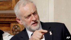 FILE - Britain's opposition Labour Party leader Jeremy Corbyn speaks after a memorial service to commemorate the 25th anniversary of the murder of black teenager Stephen Lawrence at St Martin-in-the-Fields church in London, April 23, 2018.