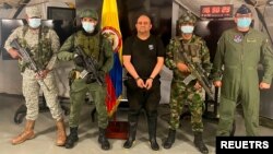 Dairo Antonio Usuga "Otoniel" David is photographed with Colombian military soldiers after being captured, in Necocli, Colombia, October 23, 2021.