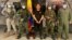 Dairo Antonio Usuga "Otoniel" David is photographed with Colombian military soldiers after being captured, in Necocli, Colombia, October 23, 2021.