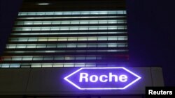 FILE - Swiss drugmaker Roche's logo is seen at their headquarters in Basel, Switzerland.