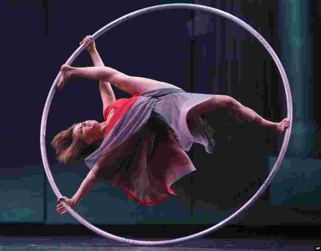 Lea Toran Jenner of the Canadian troupe Cirkopolis performs with a ring during a dress rehearsal at the Sydney Opera House in Sydney, Australia.
