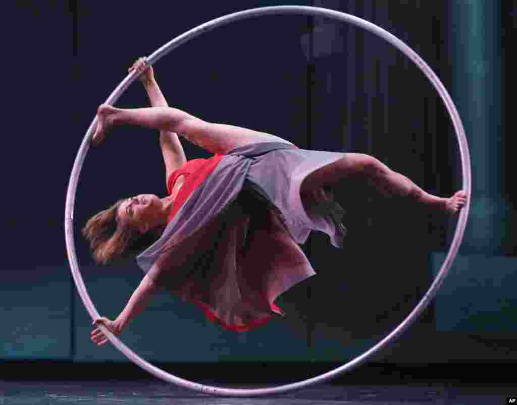 Lea Toran Jenner of the Canadian troupe Cirkopolis performs with a ring during a practice at the Sydney Opera House in Sydney, Australia. 