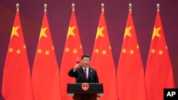 Chinese President Xi Jinping raises his glass and proposes a toast during the welcome banquet for visiting leaders attending the Belt and Road Forum at the Great Hall of the People, April 26, 2019. (Nicolas Asfouri/AP)
