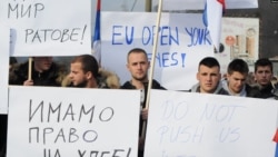 FILE - People protest after Kosovo's decision to raise tariffs on Serbian and Bosnian goods, in the village of Rudare near Mitrovica, Kosovo, Nov. 23, 2018.