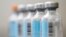 FILE - Vials of flu vaccine.