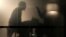 Silhouettes of visitors are seen at the App pavilion during the Mobile World Congress in Barcelona, Spain, Feb. 27, 2013. 