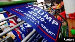 Flags for U.S. President Donald Trump's "Keep America Great!" 2020 re-election campaign are made at Jiahao flag factory in Fuyang, Anhui province, China, July 24, 2018. 