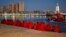 Migrants, part of a group intercepted aboard a dinghy off the coast in the Mediterranean Sea, rest after arriving on a rescue boat at the Port of Malaga, Spain, Dec. 7, 2017. 