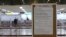 A Japan Airlines notice is displayed at Gimpo Airport in Seoul, South Korea, March 7, 2020.