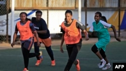 FILE - Sudanese woman football player Orjuan Essam (C), 19, takes part in a training session at a stadium in the Sudanese capital Khartoum on Nov. 20, 2019. 