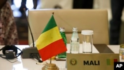 FILE - An empty seat of the representative of Mali at the fifth extraordinary ECOWAS summit in Accra, March 25, 2022.