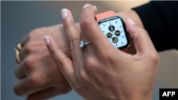 Researchers are seeking to use data collected from wearables like the Apple Watch for early signals of coronavirus infections (AFP Photo/Johannes EISELE)