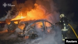 A firefighter works at a site of a residential area hit by a Russian drone strike, amid Russia's attack on Ukraine, in Sumy, Ukraine, in this handout picture released on Feb. 10, 2025. (Press service of the State Emergency Service of Ukraine in Sumy region/Handout via REUTERS)