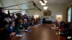 President Donald Trump meets with members of the Congressional Black Caucus in the Cabinet Room of the White House in Washington, March 22, 2017. 