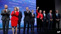 Democratic presidential candidates stand onstage during a fundraiser for the Nevada Democratic Party, Nov. 17, 2019, in Las Vegas.