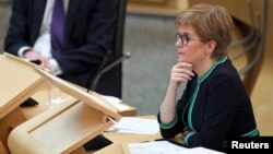 FILE - Scotland's First Minister Nicola Sturgeon appears in the Scottish Parliament in Edinburgh, Sept. 17, 2020.