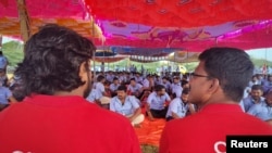 FILE - Workers of a Samsung facility attend a strike to demand higher wages at its Sriperumbudur plant near the city of Chennai, India, Sept. 12, 2024. 