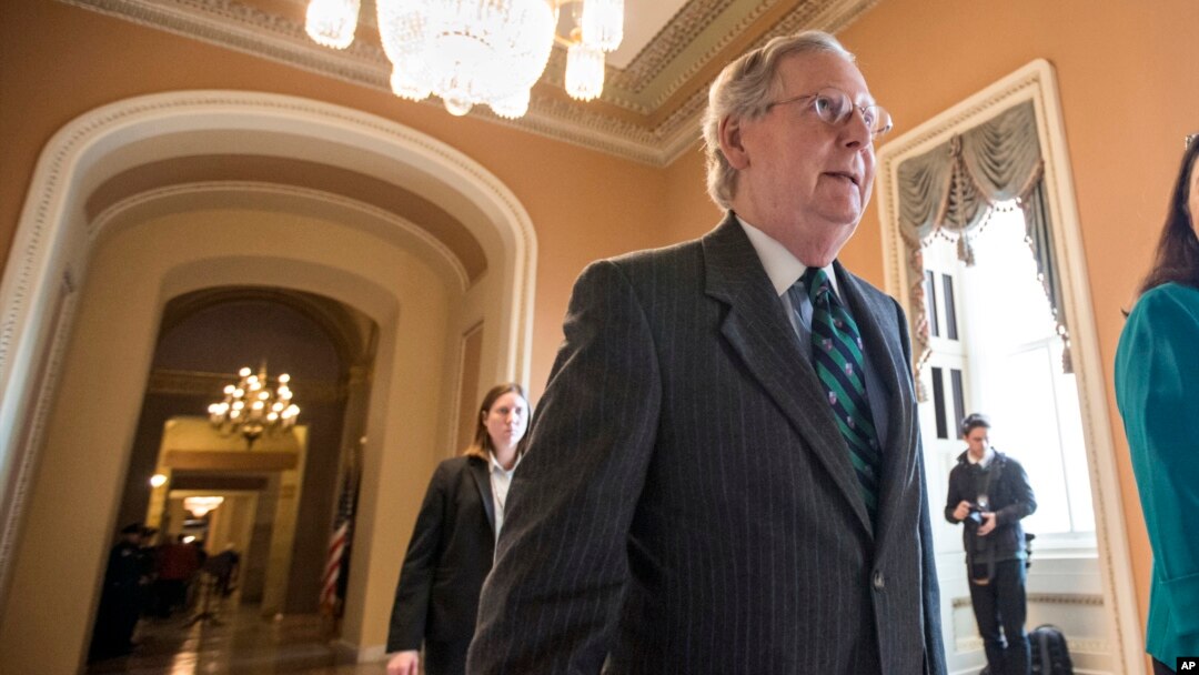 Senate Majority Leader Mitch McConnell walks to the chamber where he offered a tribute to the late Supreme Court Justice Antonin Scalia, on Capitol Hill in Washington, Feb. 22, 2016.