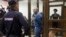 FILE - Shaltai-Boltai (Humpty-Dumpty) hacker group leader Vladimir Anikeyev is seen in an enclosure in a court room in Moscow, Russia, on Thursday, July 6, 2017. 