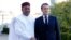 FILE - French President Emmanuel Macron, right, greets Niger President Mahamadou Issoufou prior to a meeting at the G5 Sahel summit in Pau, France, January13, 2020. On December 3, 2023, Niger and Burkina Faso announced they would withdraw from the group.