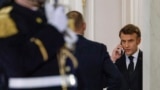 France's President Emmanuel Macron speaks on the phone prior to greeting Hungary's Prime Minister for a meeting at the Elysee Presidential Palace in Paris on March 5, 2025.