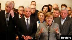 German Chancellor Angela Merkel speaks to media after exploratory talks about forming a new coalition government collapsed in Berlin, Germany, Nov. 20, 2017.