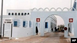 FILE: Ghriba synagogue is seen in Djerba, Tunisia, April 12, 2002. The Tunisian Interior Ministry says a naval guard shot and killed a colleague and two civilians Tuesday, May 9, 2023, near the synagogue during an annual Jewish pilgrimage. 