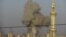 Smoke rises after a Syrian Air Force fighter jet loyal to Syria's President Bashar al-Assad fired missiles at Deraa November 4, 2012.