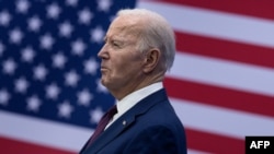 US President Joe Biden looks on before speaking about the costs of living during an address at the YMCA Allard Center March 11, 2024, in Goffstown, New Hampshire. (Photo by Brendan Smialowski / AFP)