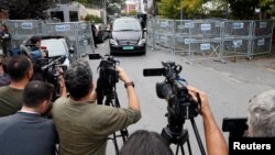 A vehicle with a diplomatic registration plate leaves from Saudi Arabia's consulate in Istanbul, Turkey, Oct. 31, 2018. 