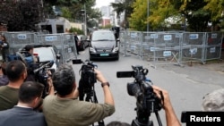 FILE - A vehicle with a diplomatic registration plate leaves from Saudi Arabia's consulate in Istanbul, Turkey, Oct. 31, 2018. 