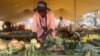 Widows displaying their farm produce and other items at an agricultural event in Victoria Falls