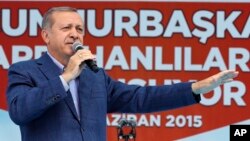 FILE - President Recep Tayyip Erdogan addresses a rally ahead of general elections in Ardahan, Turkey, June 6, 2015. 