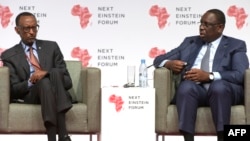 Senegalese President Macky Sall and Rwandan President Paul Kagame are seen speaking at the opening of the "Next Einstein Forum" in Dakar, March 8, 2016.