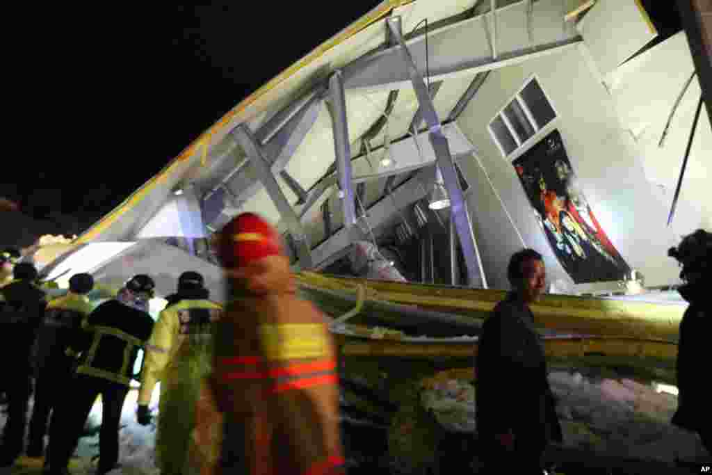 Rescue workers search for survivors from a collapsed resort building in Gyeongju, South Korea, Feb. 17, 2014. 