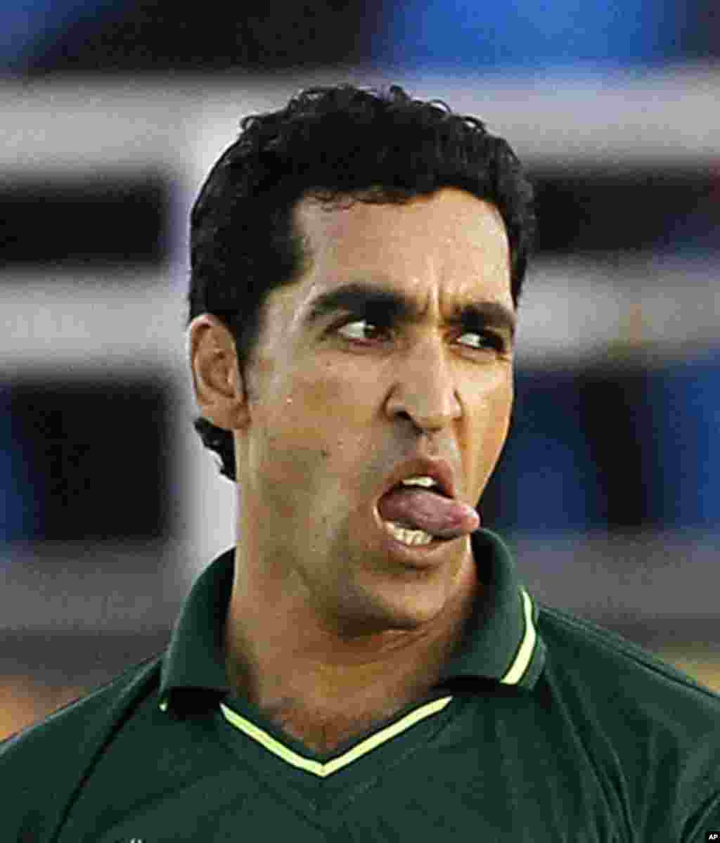 Pakistan's Umar Gul reacts while bowling during their ICC Cricket World Cup semi-final match against India in Mohali, March 30, 2011.