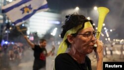 People take part in a demonstration against Israeli Prime Minister Netanyahu's government and call for the release of hostages in Gaza, in Tel Aviv