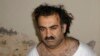 FILE - Khalid Sheikh Mohammed, the alleged Sept. 11 mastermind, is seen shortly after his capture during a raid in Pakistan on March 1, 2003. Sources said on Nov. 6, 2024, that a judge has ruled plea agreements by Mohammed and two others are valid.