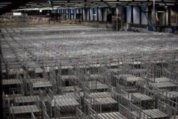 FILE - Empty racks are seen at flower auctioneer Royal FloraHolland in Aalsmeer, Netherlands, March 19, 2020. Sales at major Dutch growers have slumped, forcing farmers to destroy their flower crops.